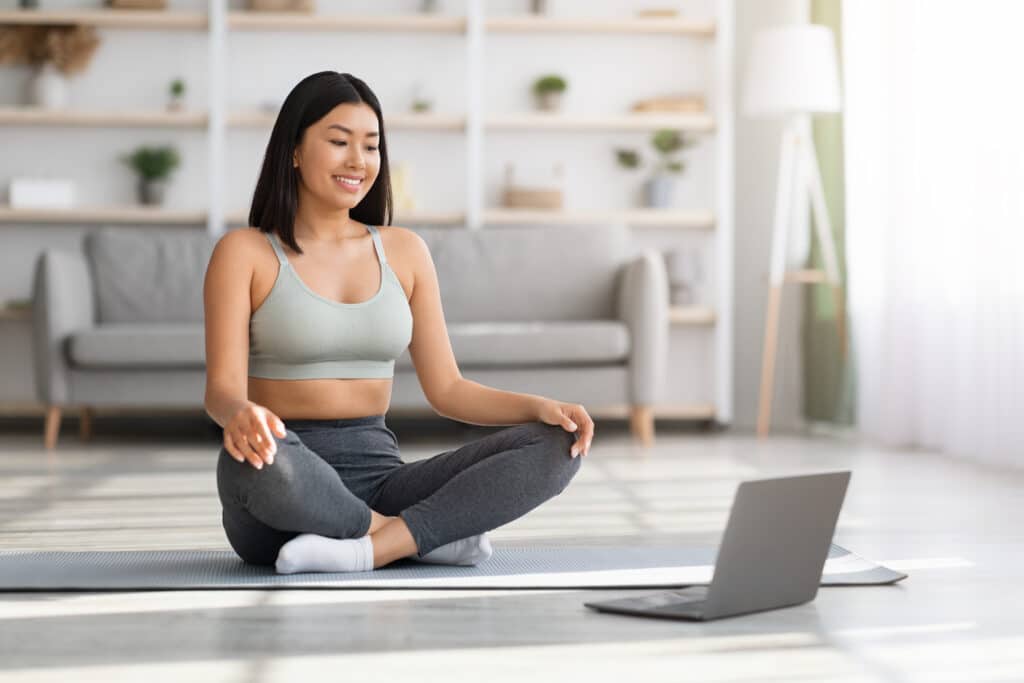 online yoga young asian woman using laptop for pr 2022 12 16 08 58 48 utc